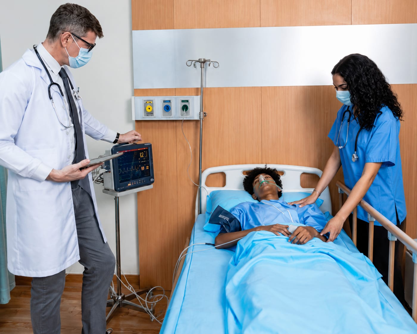 Nurse caring for a patient on a home ICU setup